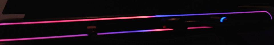 Rear light strip seen from behind: the upper strip is red on the left and blue on the right, the lower strip the other way round